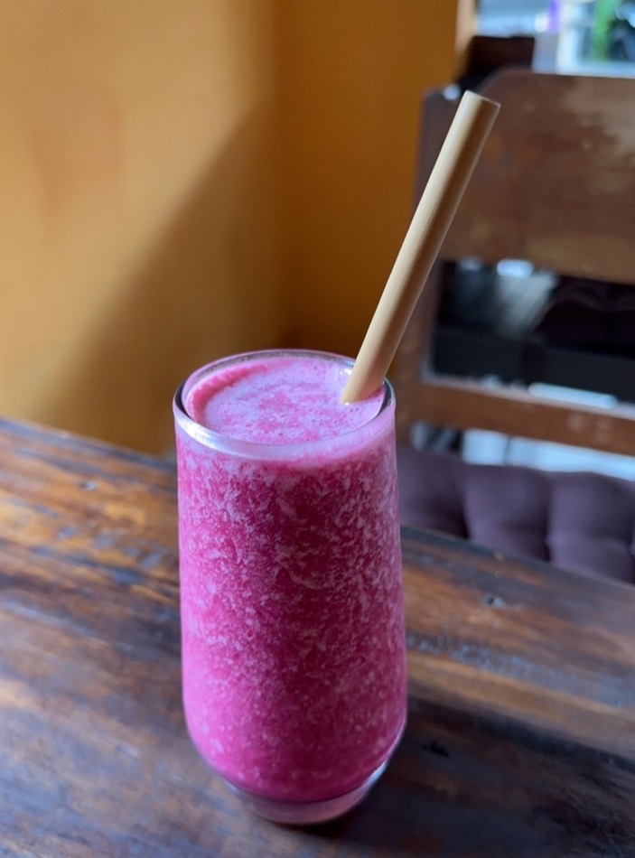 Exotic purple juice, made with sweet potato, beetroot, pineapple, coconut, mint, and honey