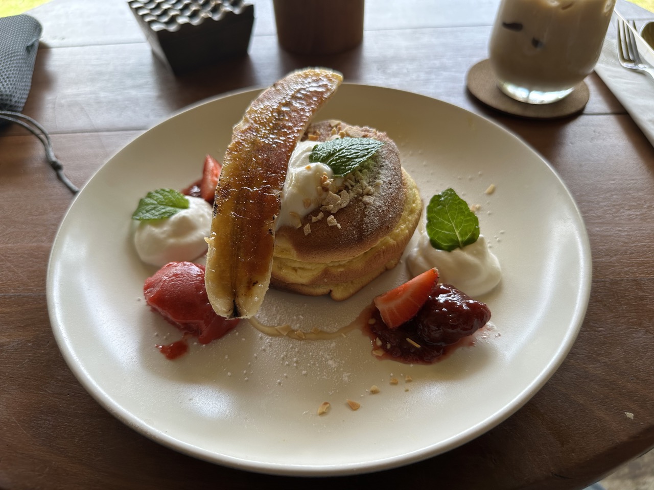 Pancakes with caramelized banana and strawberry sorbet