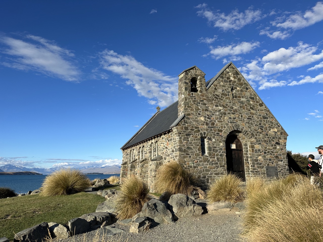 There is a quaint church right above the shore of the lake