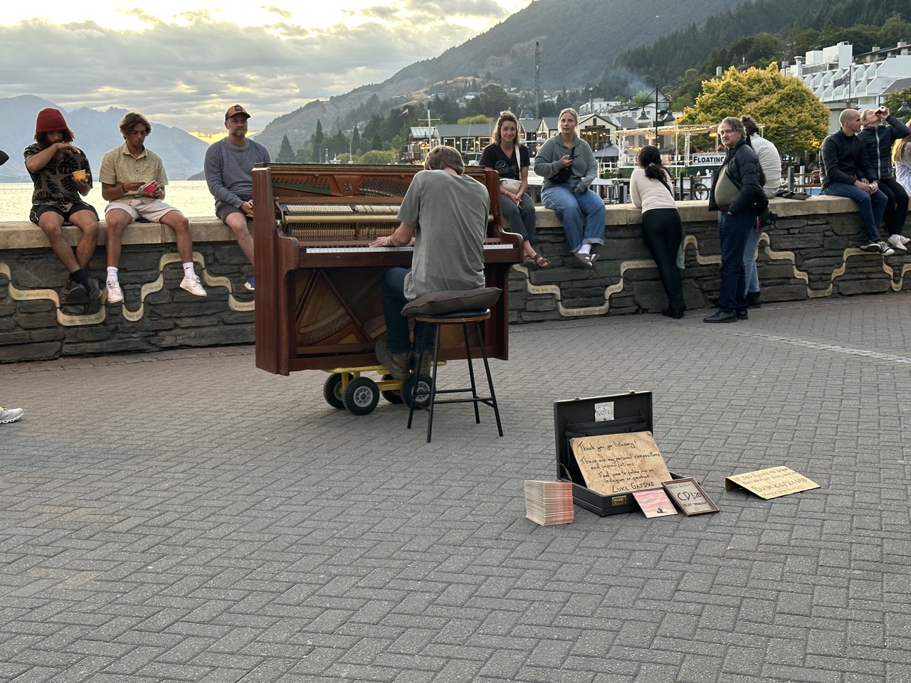 A street musician played improvised piano works right in front of the lake