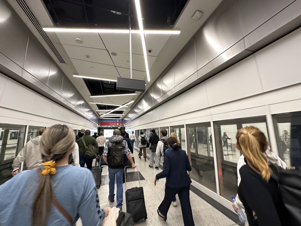 A hallway at Dubai International (DXB) heading to immigration after taking the train