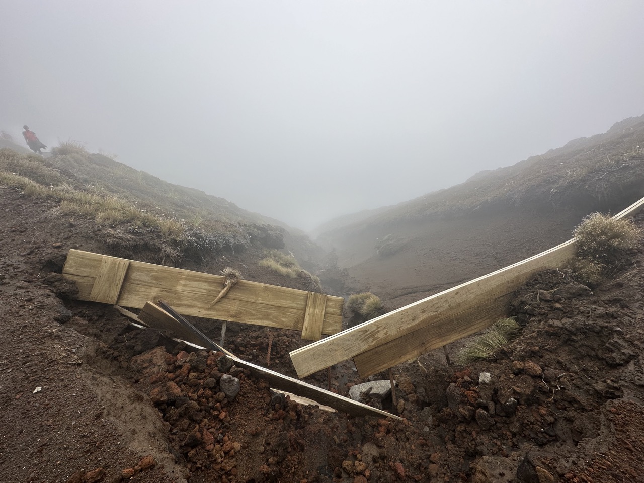 After hiking past the emerald lakes, you descend down the side of Tongariro, much of the next few miles was inside a cloud with low visibility, but at least it was a nice cool mist