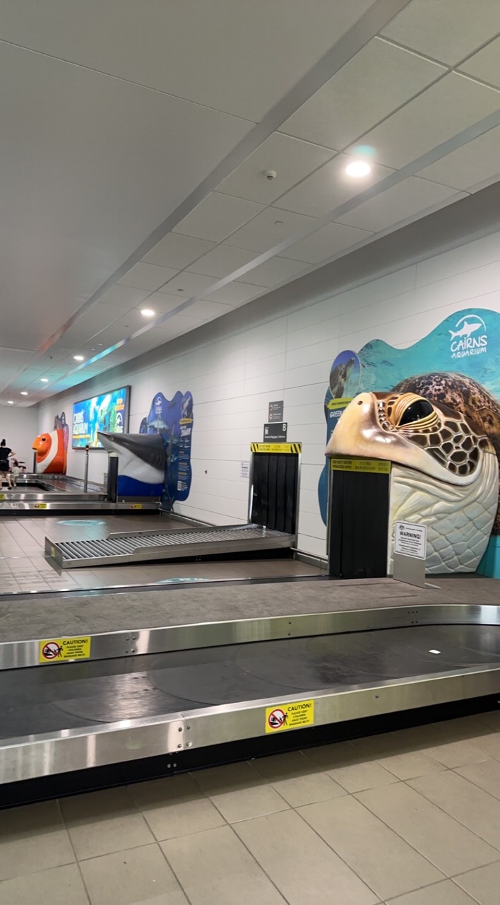 The luggage carousels at the Cairns Airport are sponsored by the Cairns Aquarium