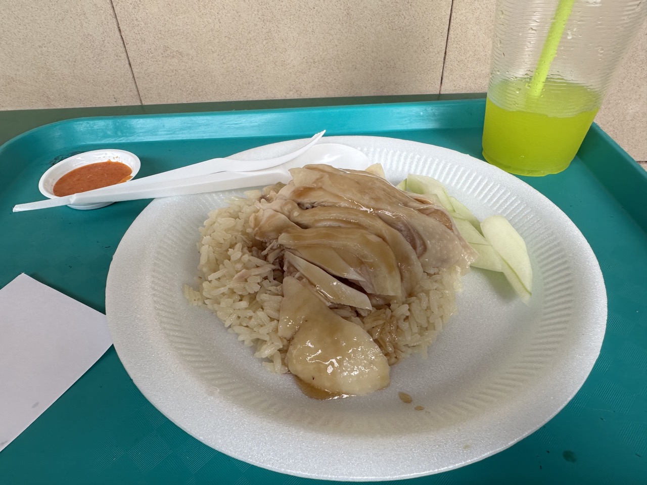 The chicken rice is fragrant, the chicken is juicy, and the chili sauce is spicy. I only wish I would've got real cutlery