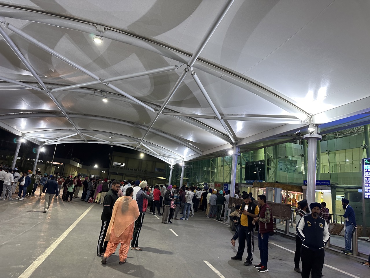 There were a lot of people waiting outside the airport to pick up friends and family