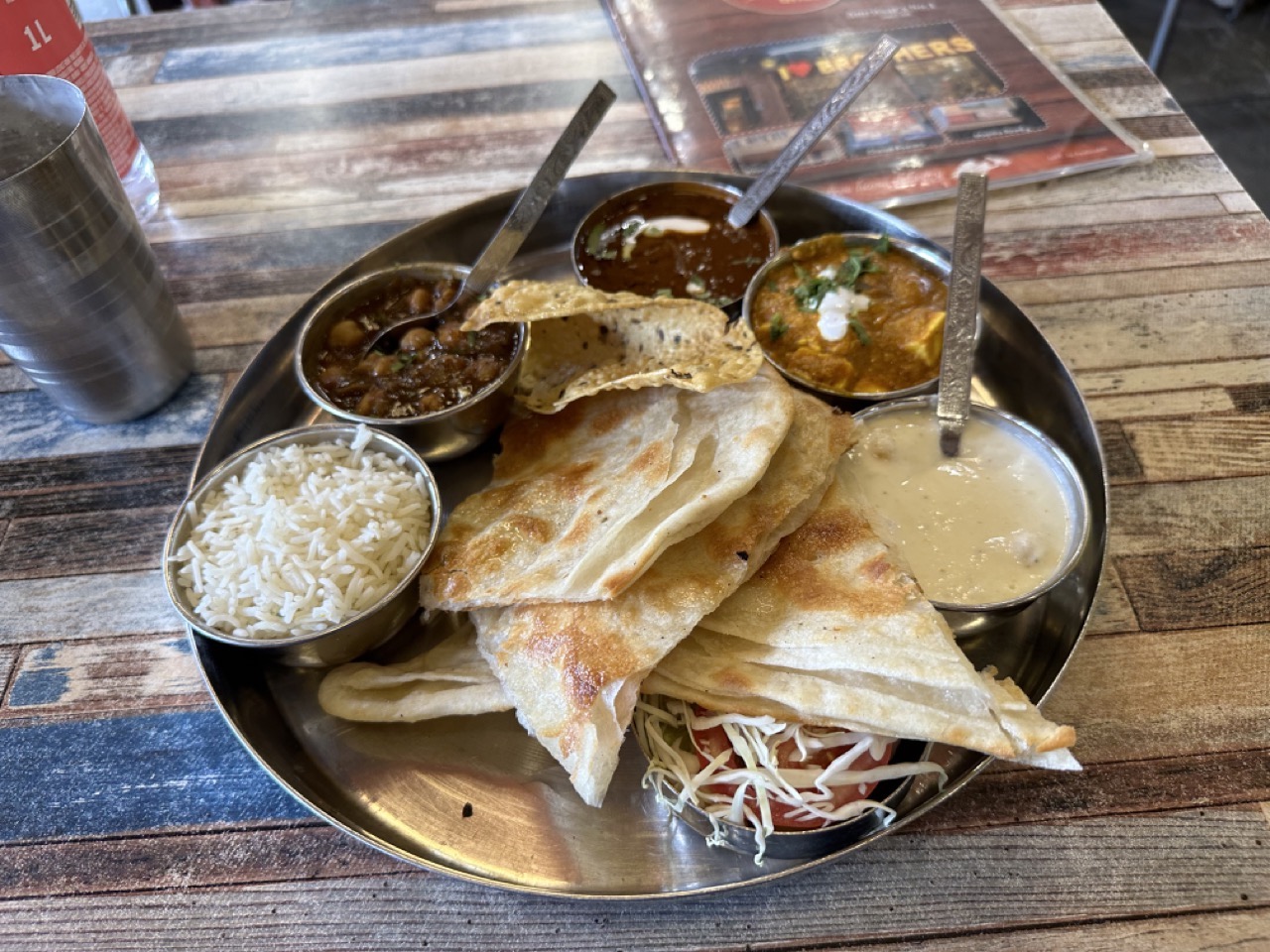 I got a big thali that came with some dal, paneer masala, a chickpea dish, curd, rice, and naan