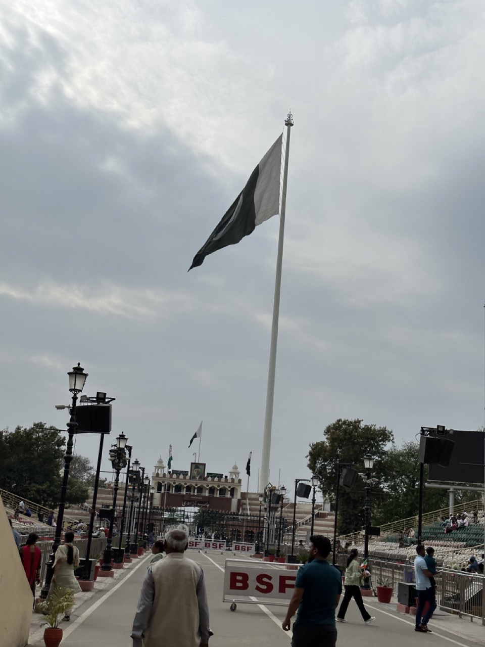 The road leading up to the border with Pakistan, with a huge Pakistani flag behind the Pakistan stadium