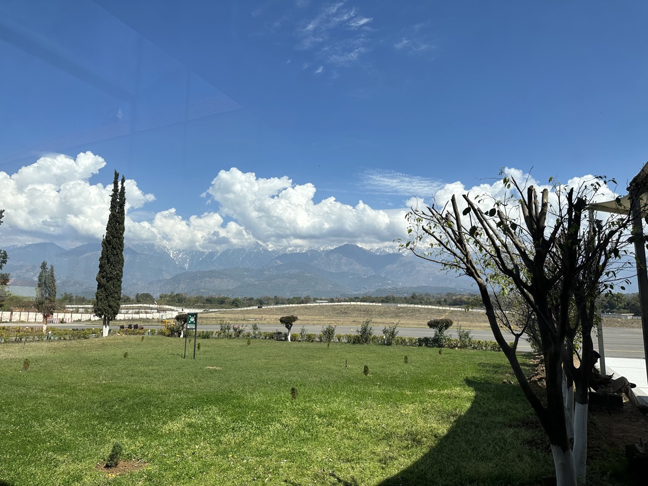 The cloud-covered mountains were visible on the other side of the runway