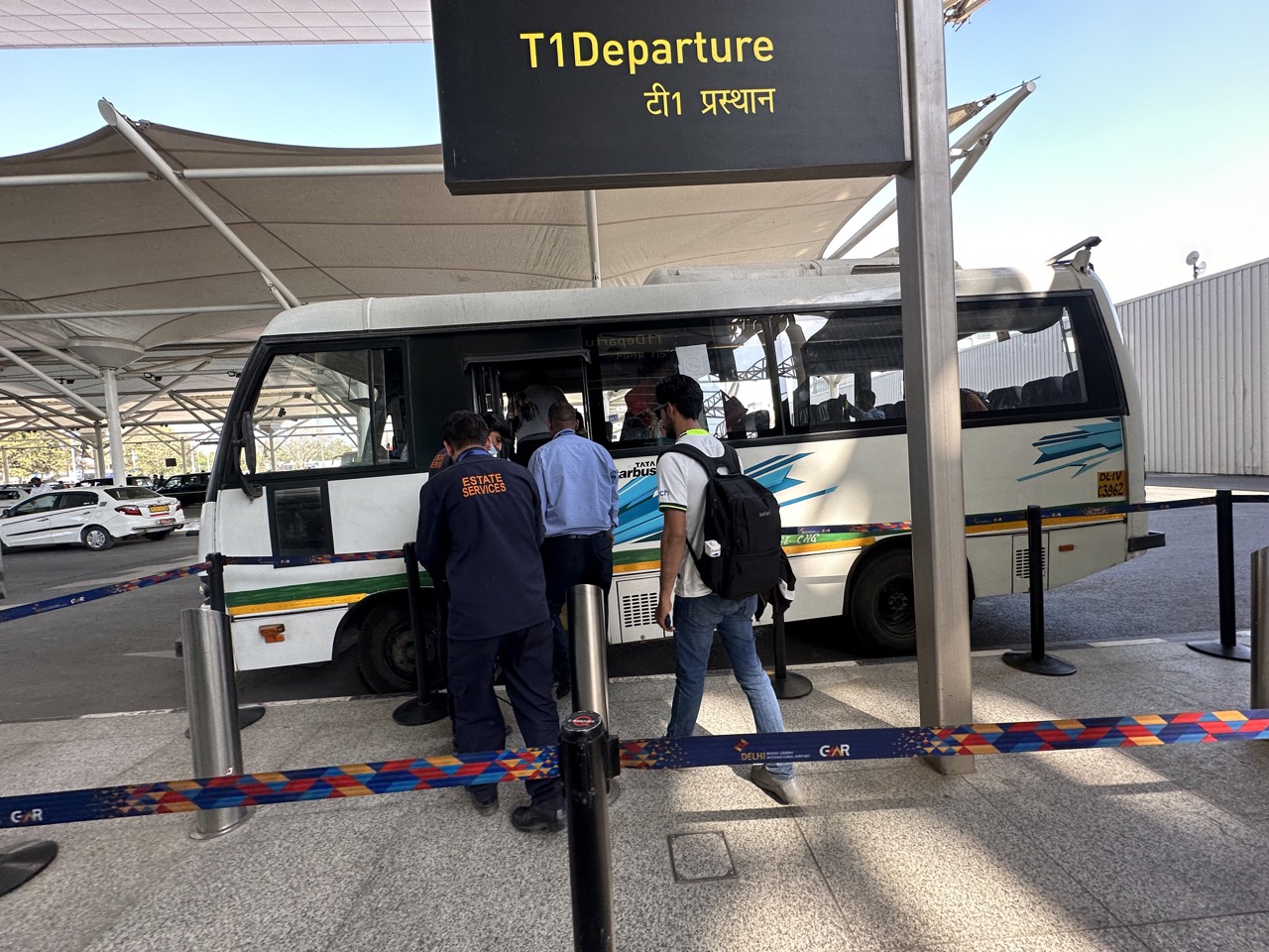 For whatever reason T1 arrivals and T1 departures are in different buildings at the Delhi airport, so you need to take a shuttle when you have a connection