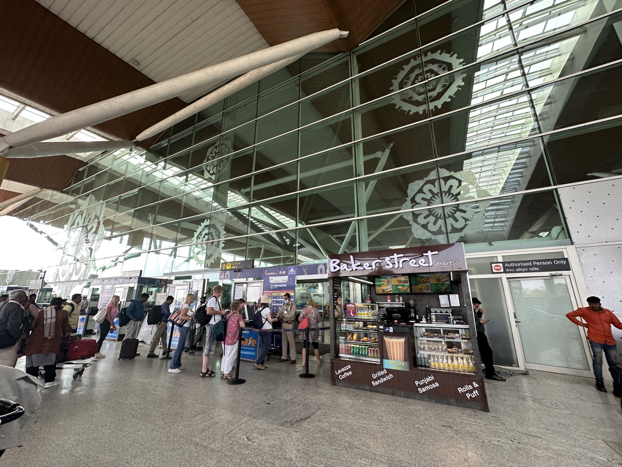 To enter the terminal you need to have a flight reservation or boarding pass, and they will scan it and compare it to your passport, so there was a long line to get back into the terminal