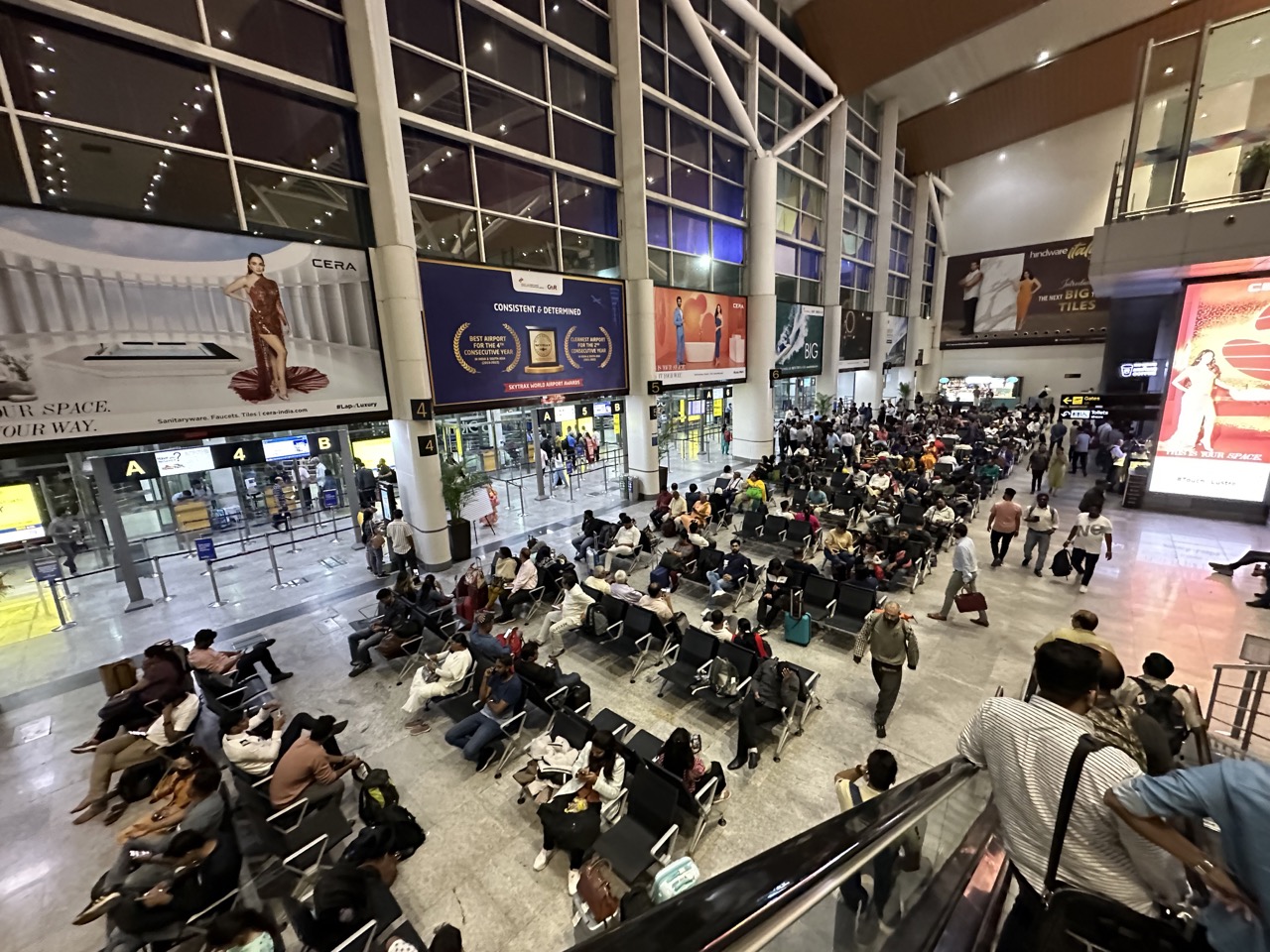 The main seating area in T1. T1 is basically a bus terminal with a central seating area, and when it is time to board you scan your boarding pass and go downstairs where there are a bunch of bus gates