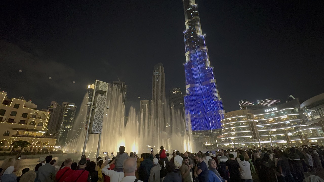 The Dubai Fountain with the bottom half of the Burj Khalifa in the background