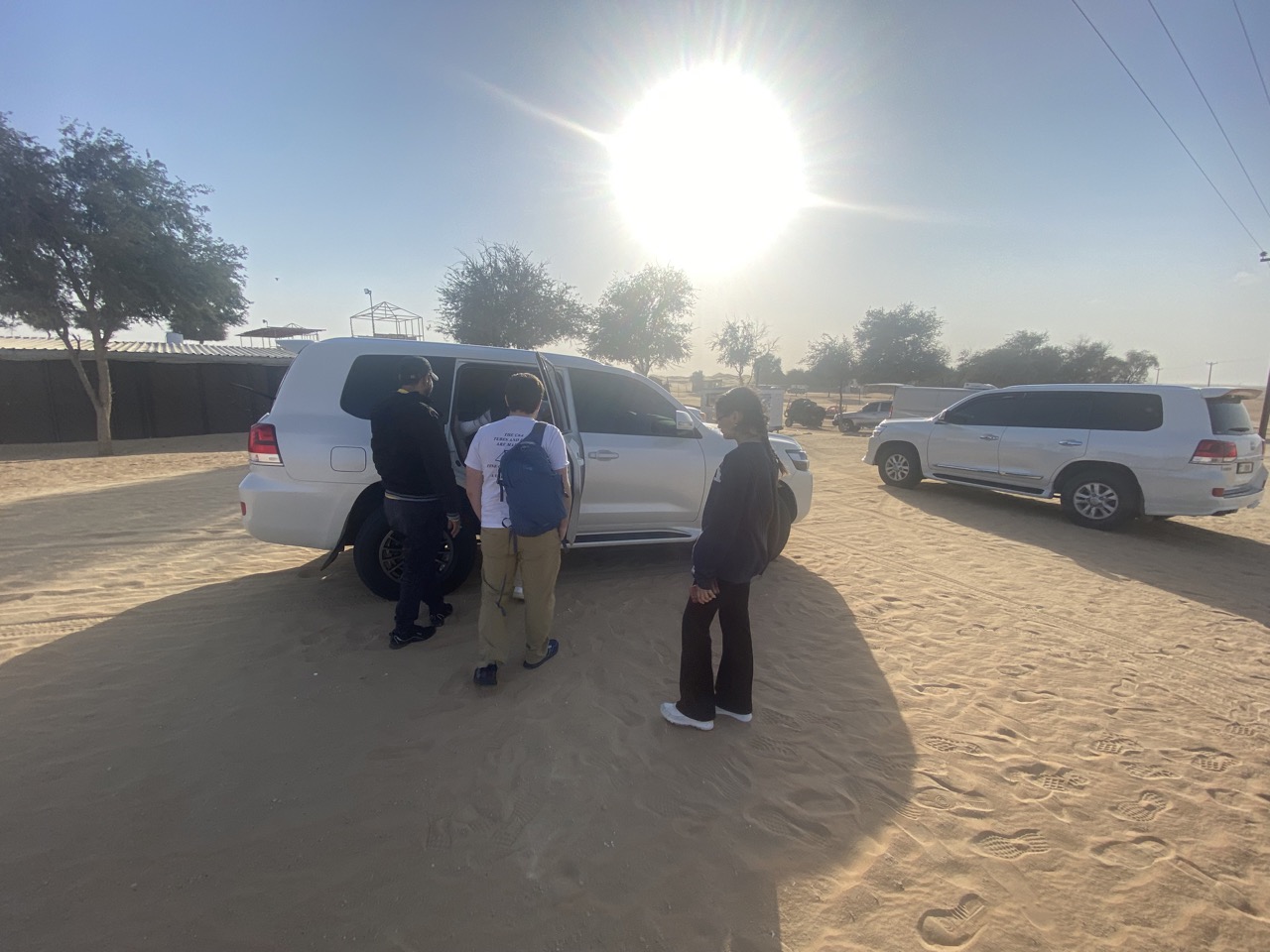 Switching into an SUV that had been prepped for dune bashing. Drivers need to reduce the tire pressure before they can drive on the dunes.