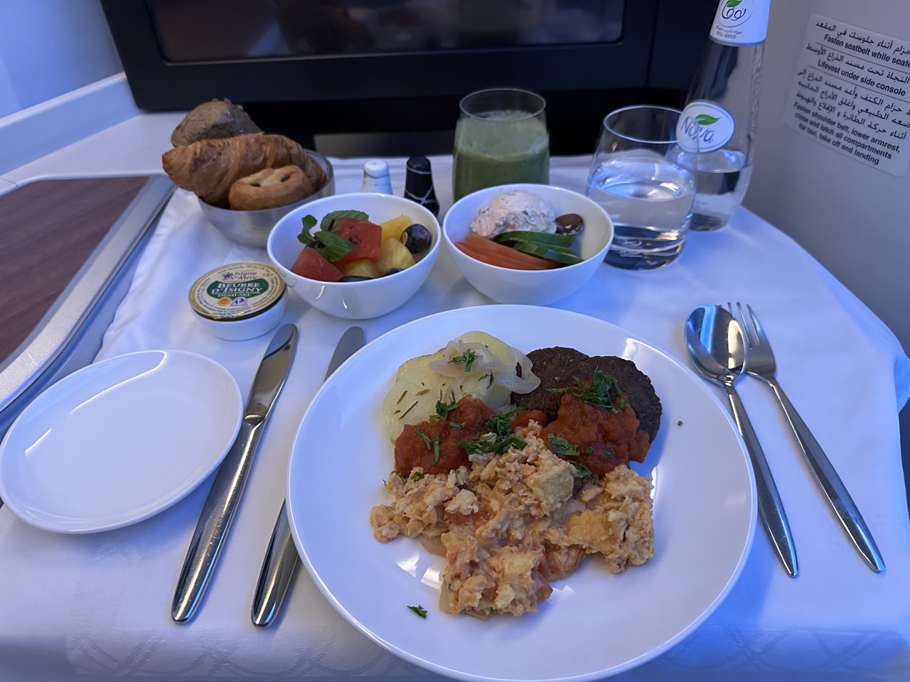 Because the flight departed at 10:50am, I was served breakfast for the third time today. I went for the shakshuka and falafel that was served with some fruit, salad, and bread. I drank a green smoothie that had kale and ginger