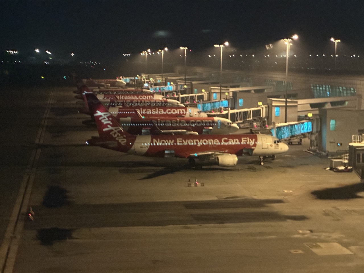 A row of AirAsia planes parked at KLIA2